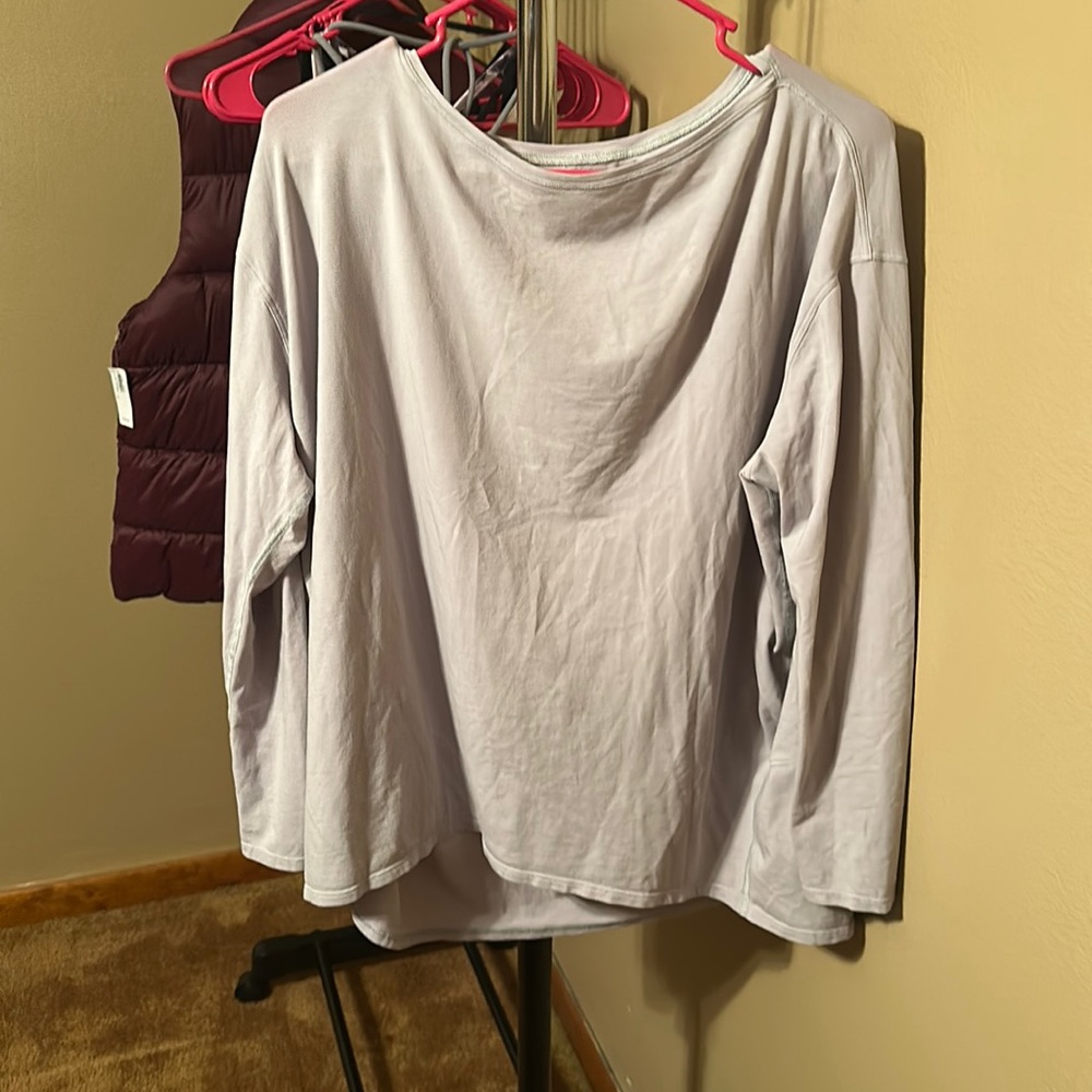 Size 12 Lululemon long sleeve. The color is lavender.